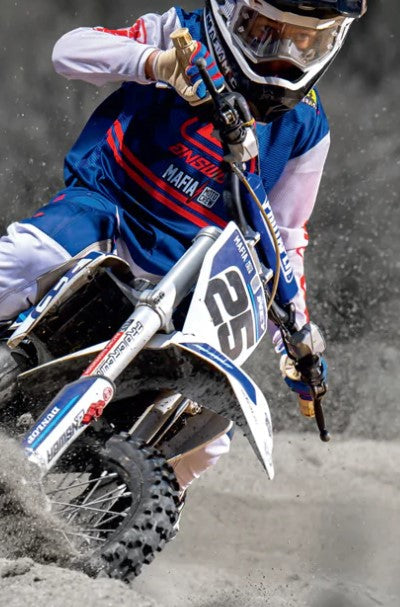 A youth rider in action on a motocross bike, wearing protective gear available from top brands like Leatt. Showcases high-performance apparel for young riders, available at Cyclespot Auckland, Taranaki, and Wellington.