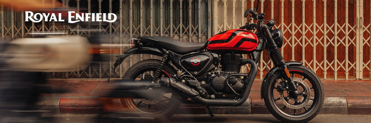 New Yamaha XSR900 GP sport motorcycle available at Cyclespot New Zealand, shown riding through an urban landscape with retro red and white styling.