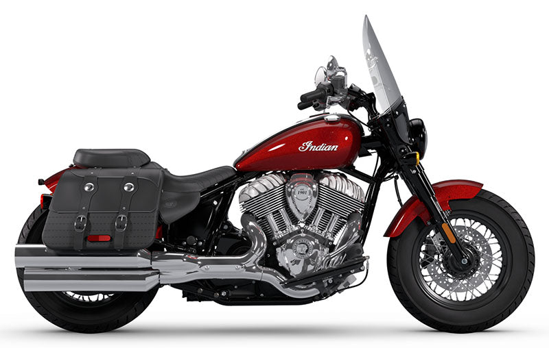 Load image into Gallery viewer, A red and black Indian Super Chief cruiser motorcycle with a large windshield, black saddlebags, and chrome exhaust pipes, shown in a side profile on a white background.
