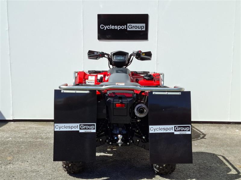 Load image into Gallery viewer, A red and black 2026 Suzuki KingQuad  LT-A500 all-terrain vehicle (ATV) is photographed from the rear, positioned in front of a white wall with a 'Cyclespot Group' sign. The vehicle features large black mudguards with 'Cyclespot Group' logos and a visible rear license plate.
