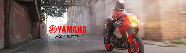 Red Yamaha XSR GP motorcycle, available from Cyclespot Group New Zealand, on a city street with the Yamaha logo.