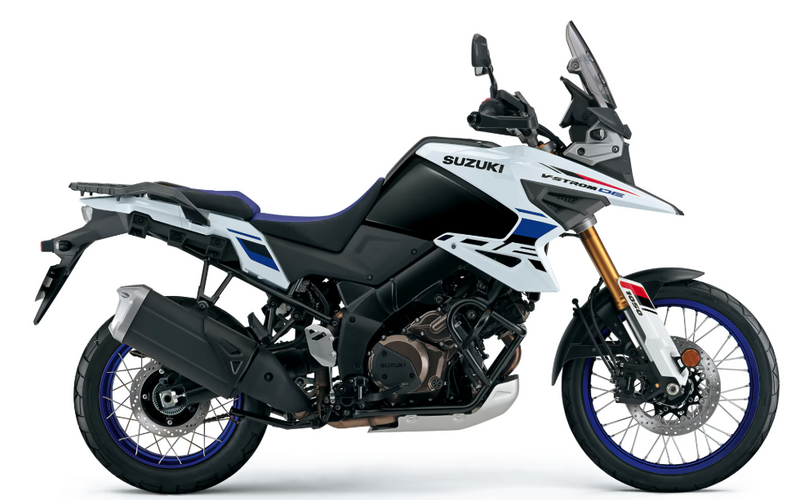 Load image into Gallery viewer, Suzuki 2025 Suzuki V-Strom 1050 RJ Adventure motorcycle in a side profile view, featuring a black and white body with blue and red accents, a tall windscreen, and gold front fork, set against a plain white background.
