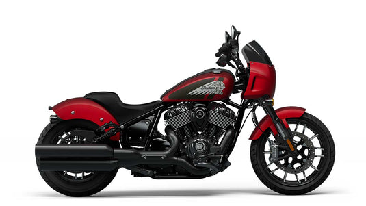 A red and black Indian Sport Chief cruiser motorcycle with a windscreen and chrome details, shown in a side profile on a white background.